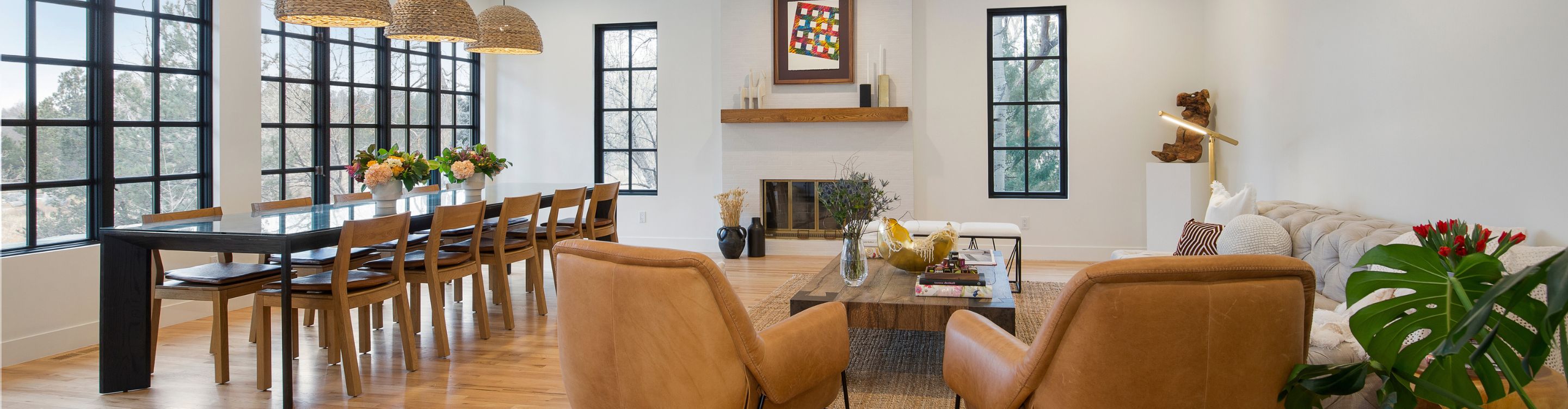 Contemporary kitchen with wood and white cabinets, wood dining table and marble stone waterfall countertop designed by Diana Bastone